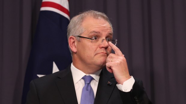 Treasurer Scott Morrison sees a budget surplus in 2020-21, although ratings agencies are not so sure.