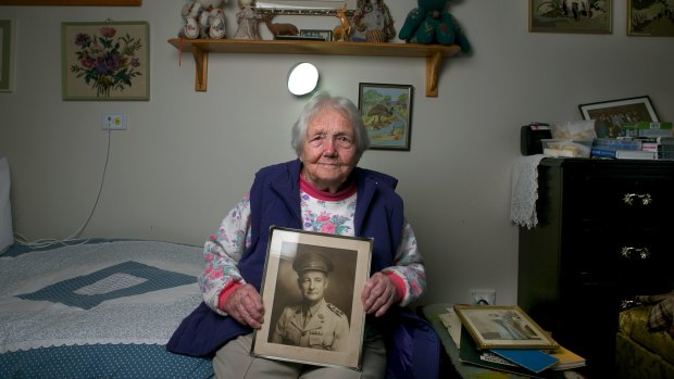World War 1 widow Mrs Doris Johnson, 91, with a photo of her late husband Neville Johnson.