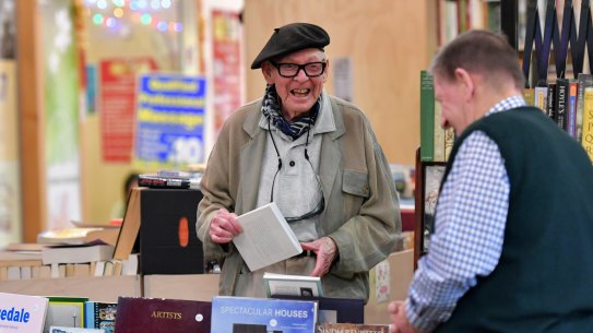 Treasured day out: Cartoonist and illustrator Vane Lindesay, 96, left, chats with Merchant of Fairness bookshop owner Rod Cameron at South Melbourne Market, which is turning 150. 