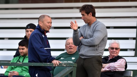 Talking tactics: England coach Eddie Jones chats with Andrew Johns at Randwick Oval during training on Monday. 
