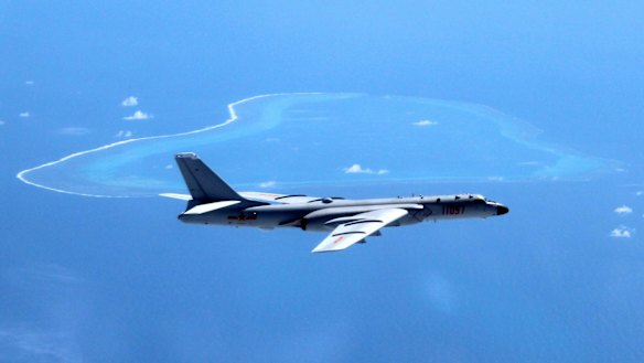 A Chinese H-6K bomber patrols the islands and reefs in the South China Sea. 