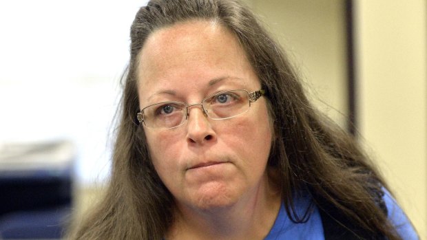 Rowan County Clerk Kim Davis listens to a customer following her office's refusal to issue marriage licences at the Rowan County Courthouse in Morehead, Kentucky.