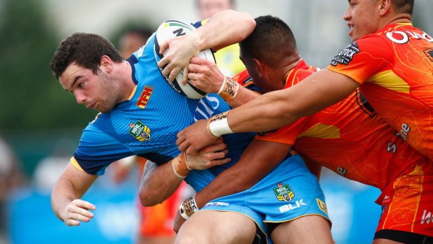 Connor Broadhurst of the Titans is tackled during the NRL trial match against the New Zealand Warriors.