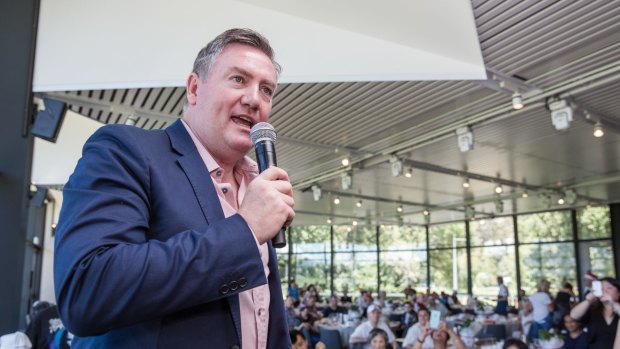 Eddie McGuire has called for those behind the anti-Muslim banner to be banned for life.