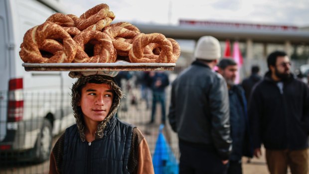 A vendor waits for customers at the Syria-Turkey border gate near Hatay in south-east Turkey.