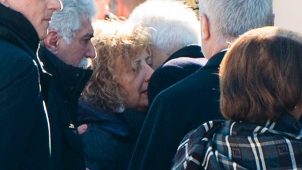 Giovanna Di Agostino, the mother of Italian Fabrizia di Lorenzo, who was killed in Berlin, is hugged by Italian President Sergio Mattarella.