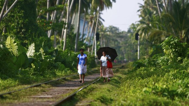 Short cut: Villagers use the rail tracks as pathways.