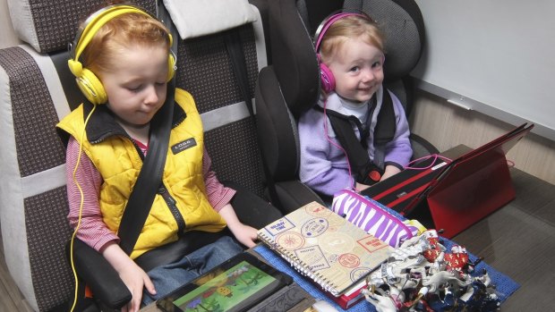 Movies keeping children occupied on a long drive.   