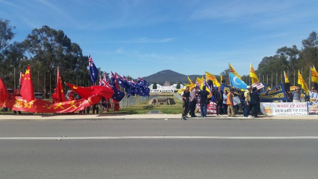 Peaceful: Protesters and supporters gathered outside Parliament House as Chinese President Xi Jinping visited Canberra on Monday.