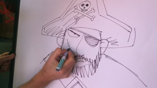 Sketching out history: Brown adds a scar to a pirate. 