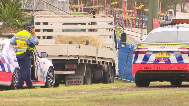 The scene where a truck driver who was pulled over by police on a road in Sydney's west got out of his rig only to be hit and killed by a semi-trailer.