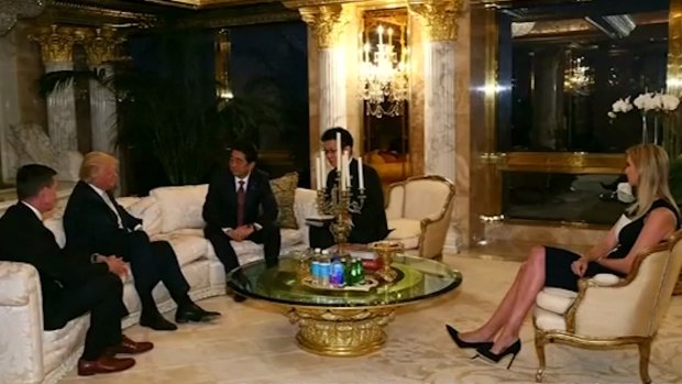 Japanese Prime Minister Shinzo Abe, third from left, meets with Donald Trump, second from left, at Trump Tower on Friday, in the presence of Mr Trump's daughter Ivanka.