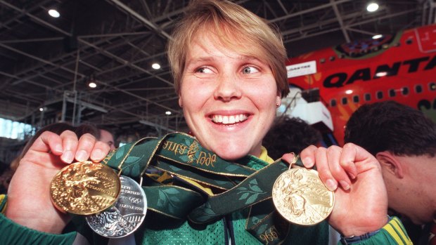 Swimmer Susie O'Neill shows off her medals from Atlanta.