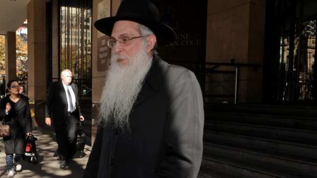 Former Yeshivah College principal Rabbi Abraham Glick leaves court in 2012.