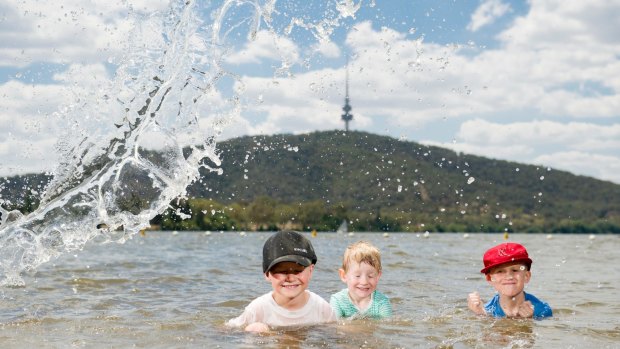 Fyn 4, Marlow, 3, and Noah Butler, 6, beating the heat in Lake Burley Griffin before the school holidays end.