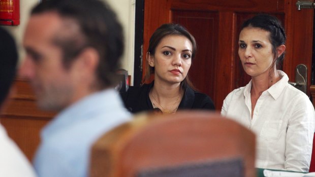 Sara Connor listens to boyfriend David Taylor during her trial in Bali.