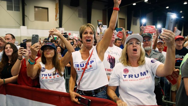 Supporters of Republican presidential candidate Donald Trump cheer during a campaign rally in Florida.