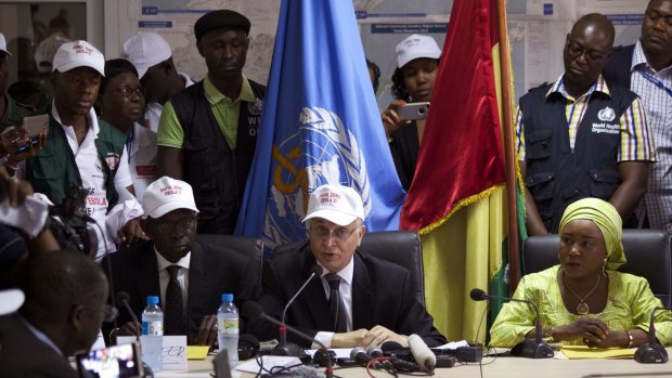 Mohamed Belhocine, centre,  a representative of the World Health Organisation, at a press briefing in Conakry, Guinea, on Tuesday.