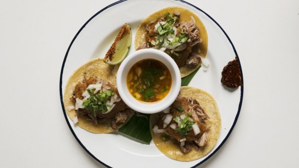 The lamb barbacoa features a slow-cooked lamb shoulder that hangs like fine ribbons on a tortilla.