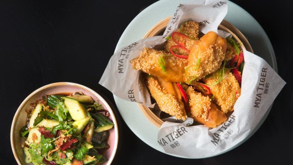 Prawn 'toasts' in Chinese doughnuts and smashed cucumber salad.