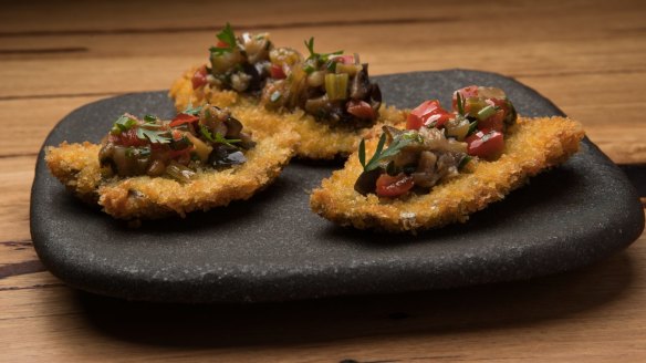 Crumbed butterflied sardines with eggplant caponata.