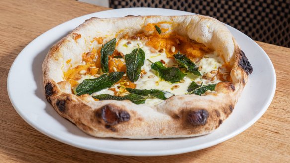 Pizza with pumpkin, stracciatella, pine nuts and fried sage.