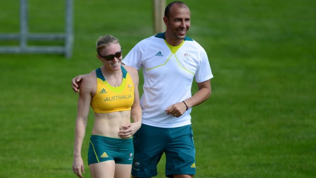 Sally Pearson shares a laugh with athletics team coach Eric Hollingsworth in 2012.