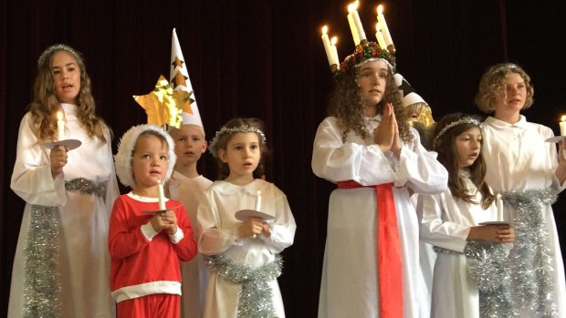Children in the traditional Lucia procession for Saturday's Scandinavian Christmas Bazaar at Albert Hall. 