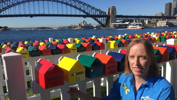 Erin Vassallo with the Fatality Free Friday letterboxes, each of which represents a death on NSW roads in 2016. Ms Vassallo's nephew died in a car crash in July 2014. 