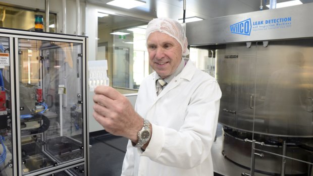 GlaxoSmithKline's Philip Leslie and the new vaccine vials which he hopes will make treatments against polio, influenza and gastro cheaper in the developing world.