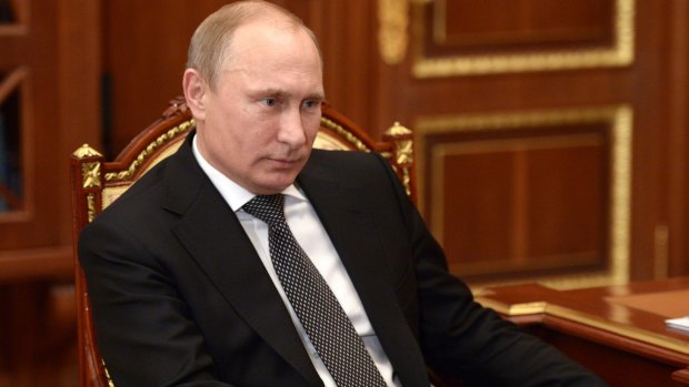 Double blow: Russian President Vladimir Putin has watched the decline of the rouble as international sanctions bite the Russian economy and oil prices fall.