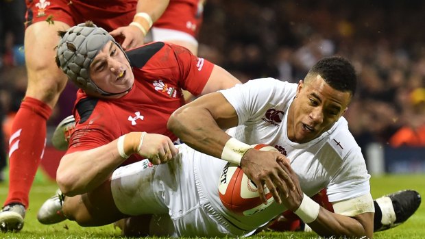 That'll do: England wing Anthony Watson touches down to score at the Millennium Stadium. 