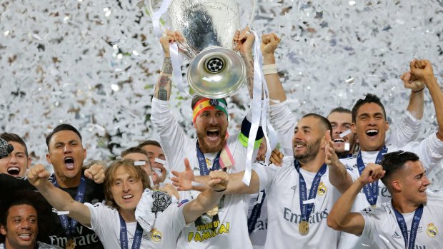 Reigning champions: Real Madrid's Sergio Ramos celebrates after the Champions League final win over Atletico Madrid in May.