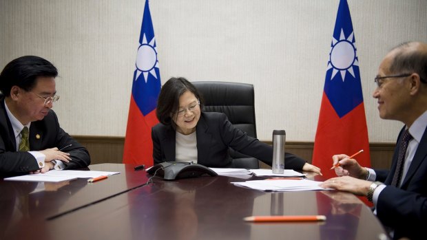 Tsai Ing-wen, flanked by National Security Council Secretary-General Joseph Wu, left, and Foreign Minister David Lee, speaks with Donald Trump on Friday.