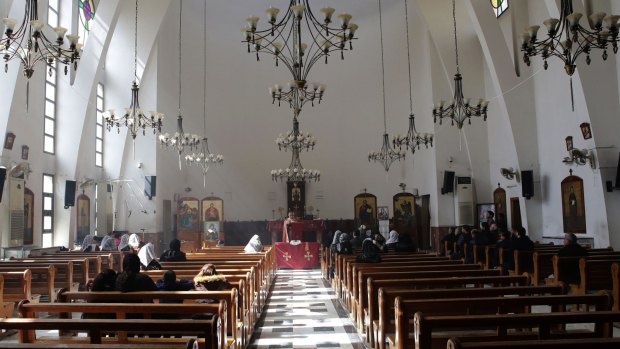 Displaced Assyrians in a prayer at the Greek Catholic church on the outskirts of the capital Damascus.