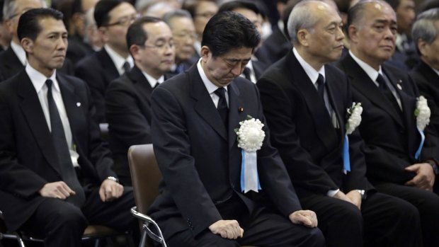 Japanese Prime Minister Shinzo Abe attends the Tokyo firebombing memorial service on March 10. He has plans to amend Japan's pacifist postwar constitution.