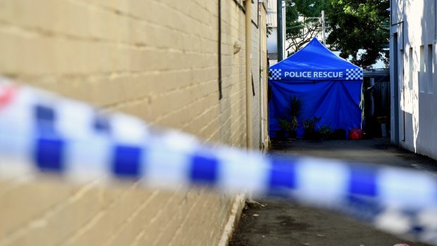 Police continue to search a home in Surry Hills, Sydney.