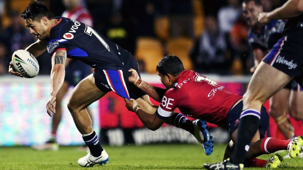 Getaway: Shaun Johnson beats the tackle from Latrell Mitchell of the Roosters to score at Mt Smart Stadium.