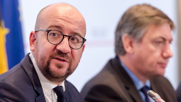 Belgian Prime Minister Charles Michel, left, and Interior Minister Jan Jambon address the media after a National Security Council meeting in Brussels on Sunday.