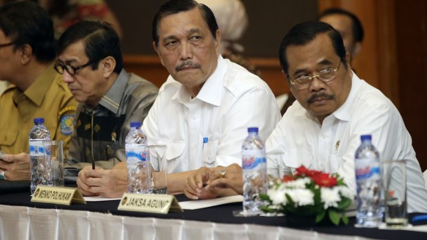 Indonesian Minister for Legal Affairs Luhut Panjaitan, centre, with Attorney General H.M. Prasetyo, right, and Justice Minister Yasonna Laoly, second left, last month.