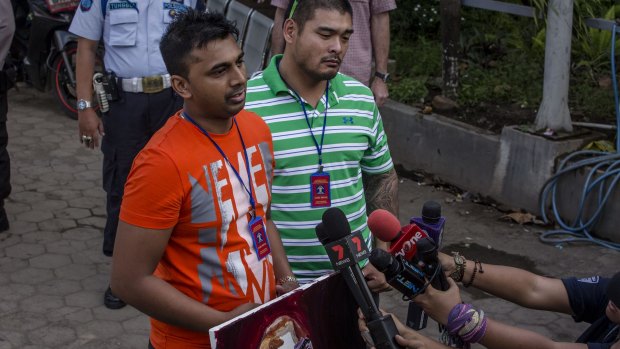 Chinthu Sukumaran (left) and Michael Chan (R), the brothers of Australians Andrew Chan and Myuran Sukumaran,  speak to journalists at Wijaya Pura port  on the eve of their brothers' executions in April  2015.