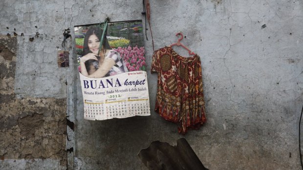 A photo, a calendar and a blouse: possessions visible as homes and workplaces were demolished in Kalijodo.