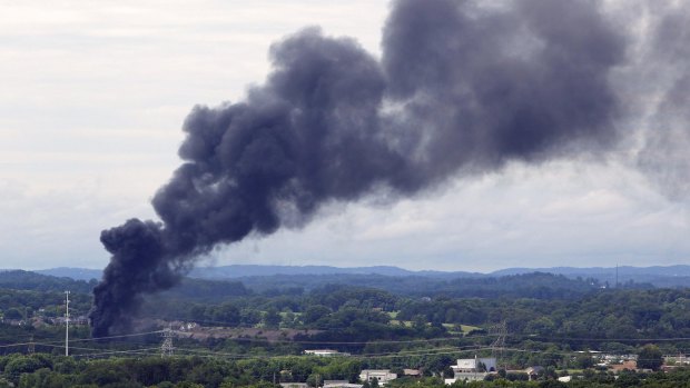 Smoke rises from the site of a train derailment near Maryville, Tennessee.