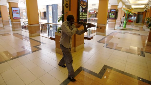 September 2013: an armed policeman searches for gunmen during the attack at  the Westgate shopping mall.