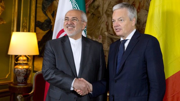 Iranian Foreign Minister Mohammad Javad Zarif, left, shakes hands with his Belgian counterpart Didier Reynders during a meeting at the Egmont Palace in Brussels earlier this month.