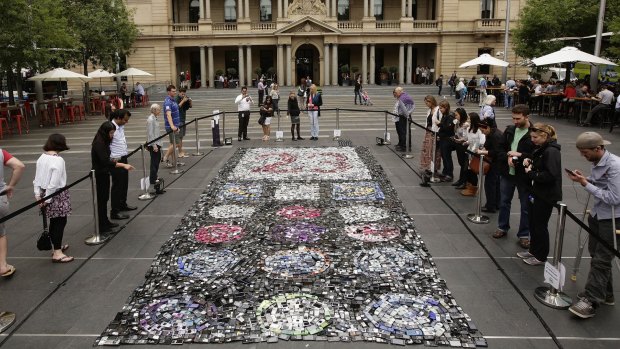 Waste not: Chris Jordan's artwork made from nearly 6,000 unused mobile phones at Customs House. The work aims to draw attention to the environmental impact not recycling old phones has on the planets resources.  