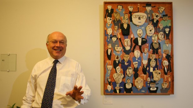 Arts Minister Senator George Brandis pictured in 2007 with Bill Hay's painting <i>The Convention</i> hanging in the entrance to his Parliament House office.