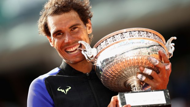 Rafael Nadal is jubilant as he holds the trophy.