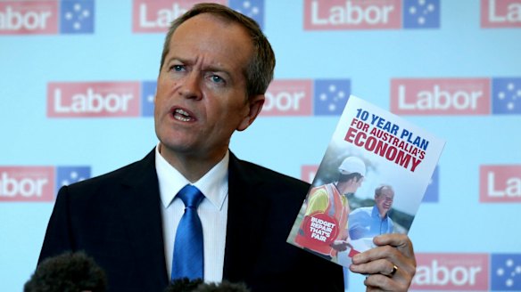 Mr Shorten with the Labor Party's election booklet. 