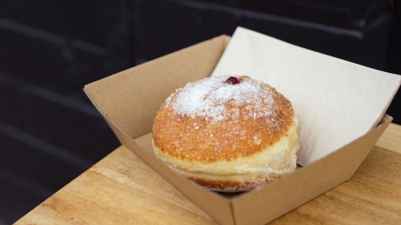 Black Market's jam-filled doughnut glistens with sugar.